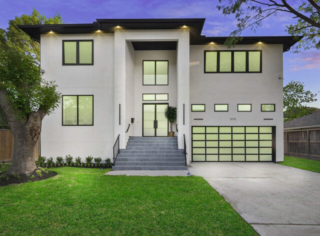 5115 Maple St, Houston, TX 77401 - modern home featuring stucco siding, concrete driveway, and a garage