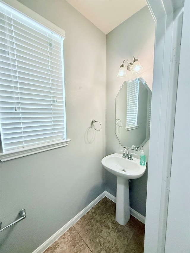 13938 Kenswick Key Ln, Houston, TX 77047 - bathroom with baseboards and tile patterned floors