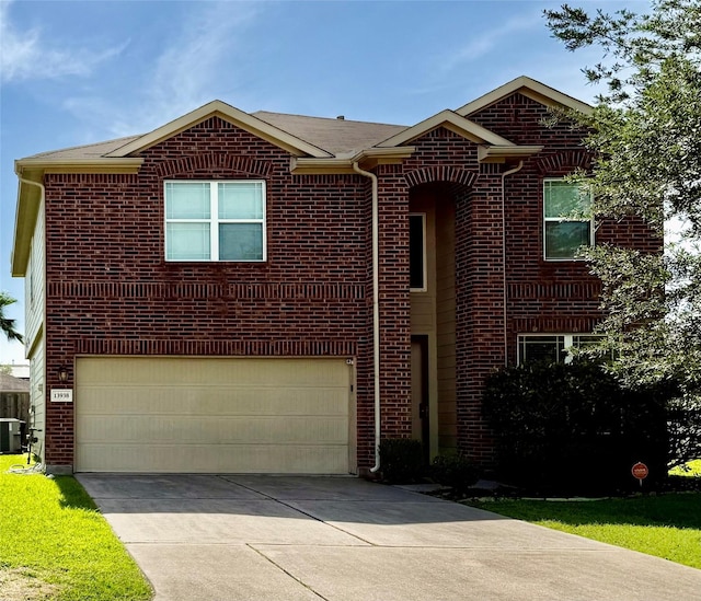 13938 Kenswick Key Ln, Houston, TX 77047 - view of front of home with an attached garage, driveway, brick siding, and central AC unit