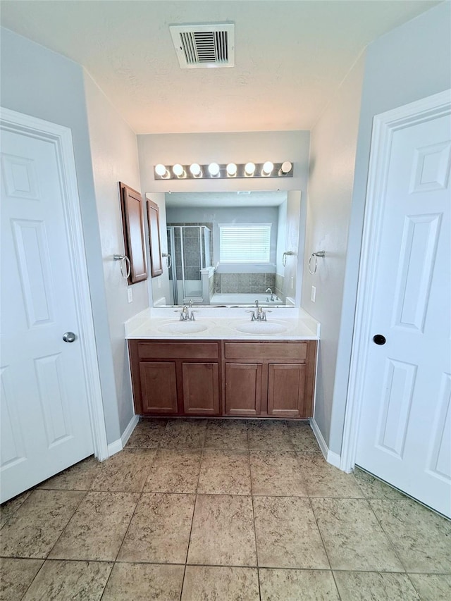 13938 Kenswick Key Ln, Houston, TX 77047 - bathroom with a stall shower, baseboards, and double vanity