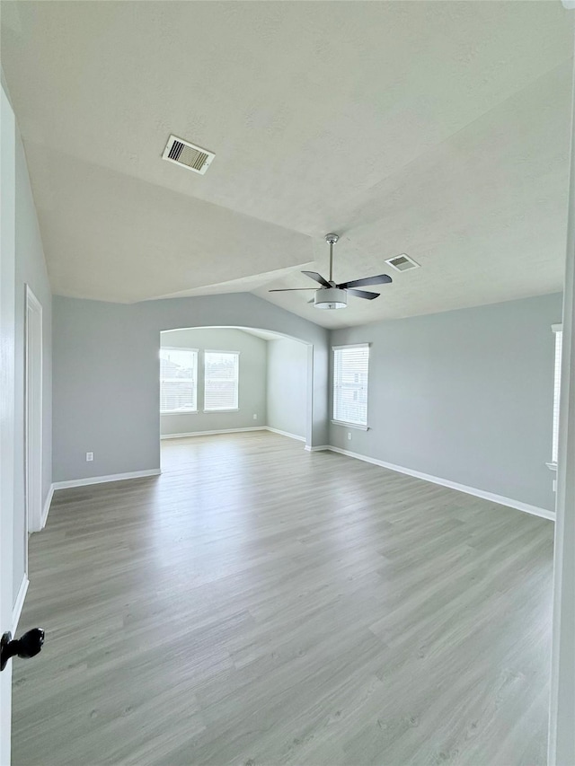13938 Kenswick Key Ln, Houston, TX 77047 - unfurnished room with ceiling fan, healthy amount of natural light, baseboards, and vaulted ceiling