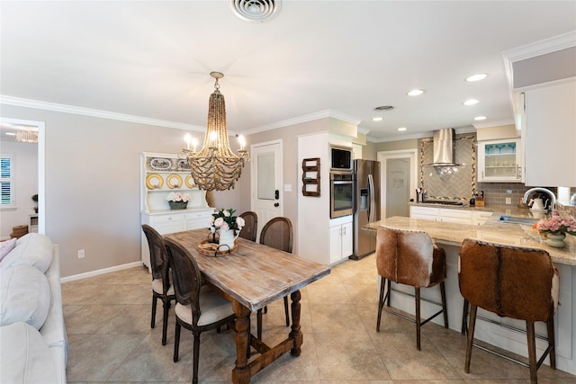 8914 Railton St, Houston, TX 77080 - dining area with a chandelier, light tile patterned flooring, ornamental molding, and recessed lighting