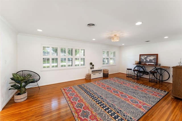 8914 Railton St, Houston, TX 77080 - living area with wood finished floors, crown molding, recessed lighting, and baseboards