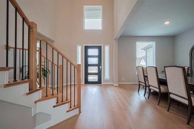 21714 Jenolan Ridge Rd, Cypress, TX 77433 - foyer featuring healthy amount of natural light, wood-type flooring, stairway, and recessed lighting