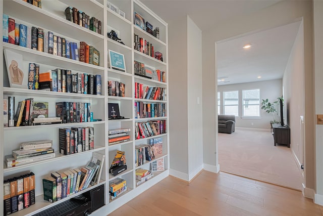 21714 Jenolan Ridge Rd, Cypress, TX 77433 - hall with baseboards and wood finished floors