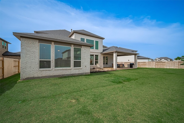 21714 Jenolan Ridge Rd, Cypress, TX 77433 - rear view of property featuring a patio area, brick siding, and a shingled roof