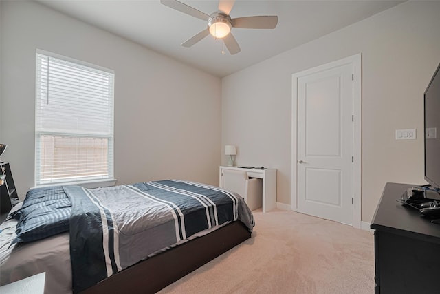 21714 Jenolan Ridge Rd, Cypress, TX 77433 - bedroom with light carpet, multiple windows, baseboards, and ceiling fan