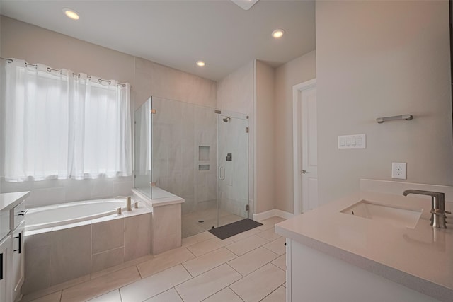 21714 Jenolan Ridge Rd, Cypress, TX 77433 - full bath featuring vanity, a bath, a shower stall, tile patterned flooring, and recessed lighting