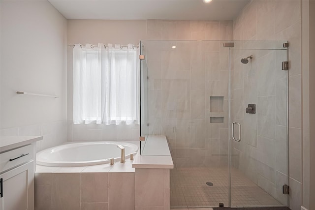 21714 Jenolan Ridge Rd, Cypress, TX 77433 - full bathroom with a garden tub, vanity, and a stall shower