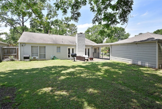 12007 Nova Dr, Houston, TX 77077 - rear view of house featuring a chimney, an outdoor hangout area, brick siding, and french doors