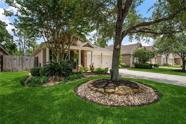 27438 Channing Springs Dr, Spring, TX 77386 - view of front facade featuring driveway, a garage, and brick siding