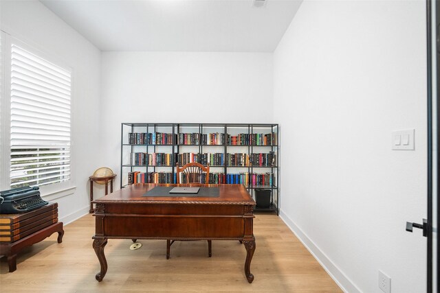 15040 Berry Brook Dr, Conroe, TX 77302 - home office featuring light wood-type flooring and baseboards