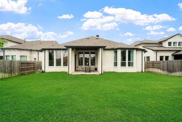15040 Berry Brook Dr, Conroe, TX 77302 - back of house featuring a patio, brick siding, and roof with shingles