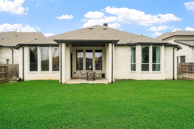 15040 Berry Brook Dr, Conroe, TX 77302 - rear view of property featuring a patio area, brick siding, and roof with shingles