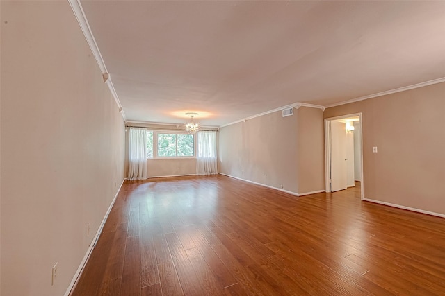 642 S Ripple Creek Dr Unit 642, Houston, TX 77057 - spare room featuring a chandelier, crown molding, baseboards, and wood finished floors