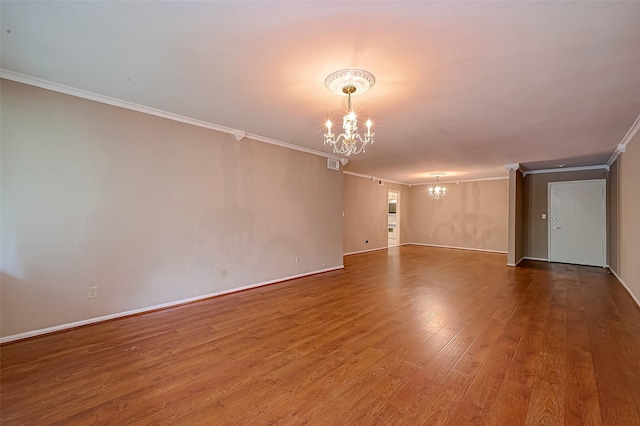 642 S Ripple Creek Dr Unit 642, Houston, TX 77057 - spare room with a chandelier, crown molding, wood finished floors, and baseboards