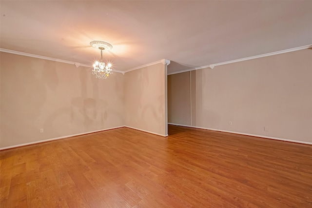 642 S Ripple Creek Dr Unit 642, Houston, TX 77057 - spare room with ornamental molding, a chandelier, wood finished floors, and baseboards