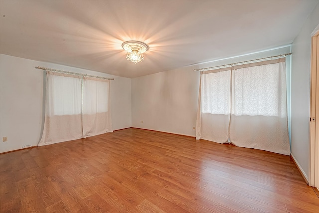 642 S Ripple Creek Dr Unit 642, Houston, TX 77057 - spare room featuring light wood-type flooring and baseboards