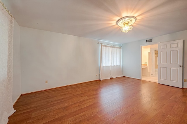 642 S Ripple Creek Dr Unit 642, Houston, TX 77057 - unfurnished bedroom featuring wood finished floors, connected bathroom, and baseboards
