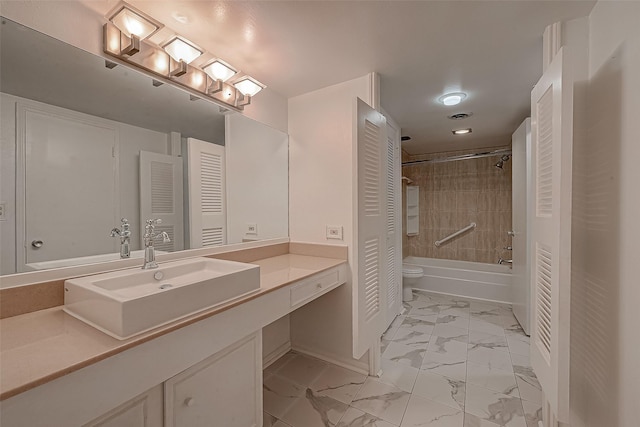 642 S Ripple Creek Dr Unit 642, Houston, TX 77057 - bathroom with marble finish floors, baseboards, a closet, vanity, and toilet