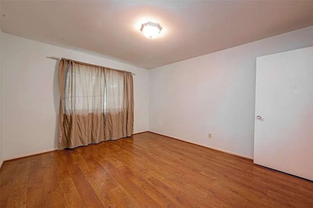 642 S Ripple Creek Dr Unit 642, Houston, TX 77057 - spare room featuring wood finished floors and baseboards