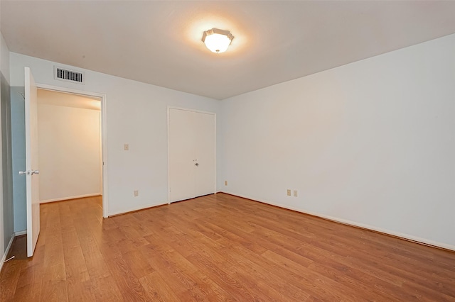 642 S Ripple Creek Dr Unit 642, Houston, TX 77057 - unfurnished bedroom featuring light wood-style floors and baseboards