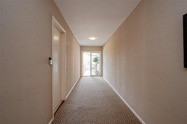 642 S Ripple Creek Dr Unit 642, Houston, TX 77057 - corridor featuring carpet flooring, baseboards, and a textured wall