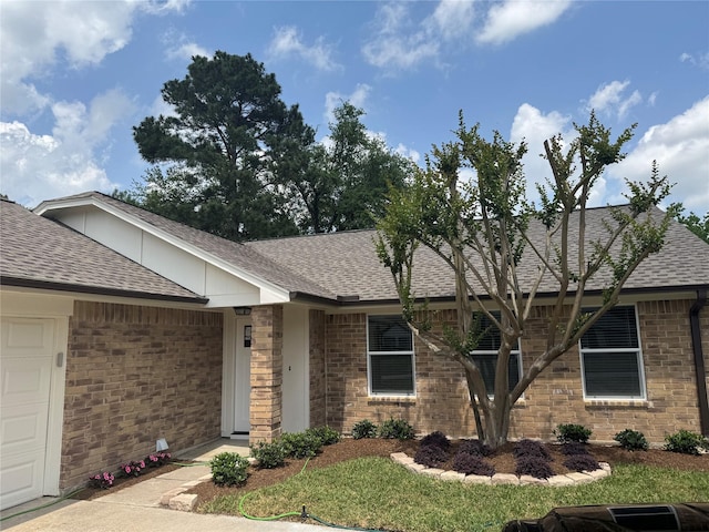 19710 Auburn Park Ln, Spring, TX 77379 - ranch-style home featuring roof with shingles, brick siding, and an attached garage