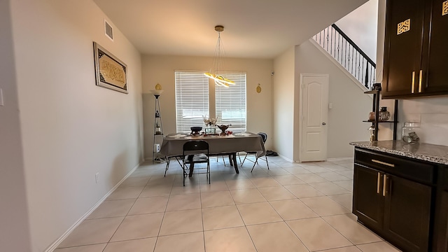 22614 Rosy Heights Trl, Tomball, TX 77377 - dining room with light tile patterned flooring, stairway, and baseboards