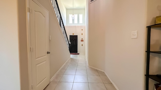22614 Rosy Heights Trl, Tomball, TX 77377 - corridor with light tile patterned floors, stairs, and baseboards