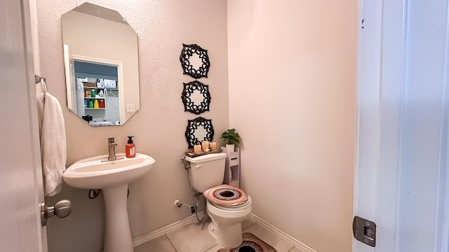 22614 Rosy Heights Trl, Tomball, TX 77377 - bathroom with toilet, tile patterned flooring, baseboards, and a sink