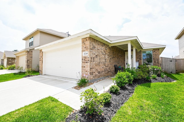 2728 Cadiz Bay Dr, Conroe, TX 77301 - view of front of property featuring brick siding, concrete driveway, and a garage