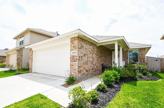 2728 Cadiz Bay Dr, Conroe, TX 77301 - view of front of property with brick siding, concrete driveway, and a garage