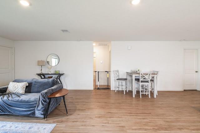2728 Cadiz Bay Dr, Conroe, TX 77301 - living area featuring light wood-type flooring and baseboards