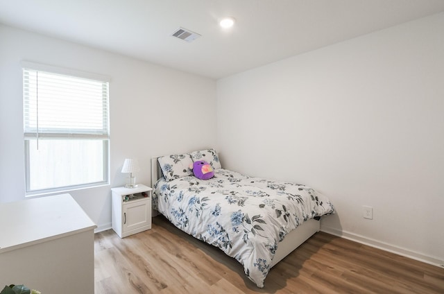 2728 Cadiz Bay Dr, Conroe, TX 77301 - bedroom featuring light wood-style flooring and baseboards