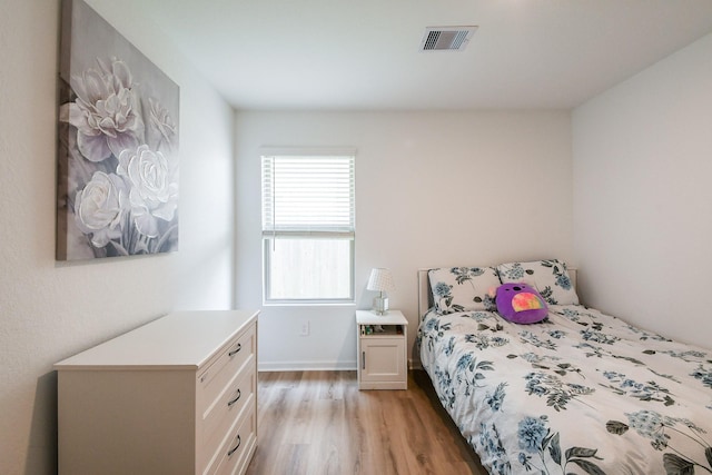 2728 Cadiz Bay Dr, Conroe, TX 77301 - bedroom with light wood-style floors