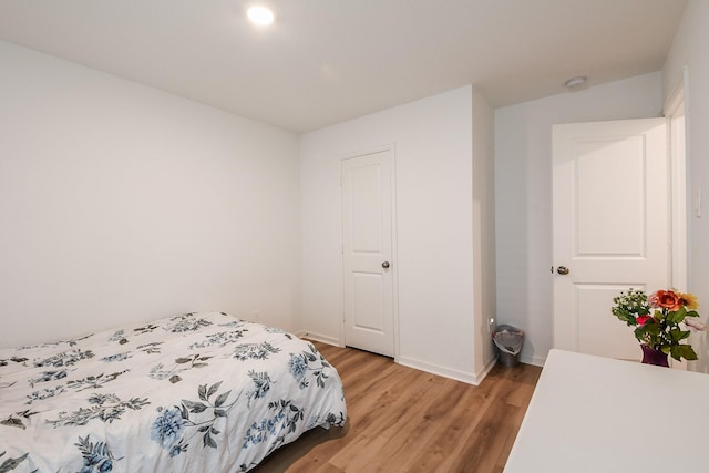 2728 Cadiz Bay Dr, Conroe, TX 77301 - bedroom with light wood finished floors and baseboards