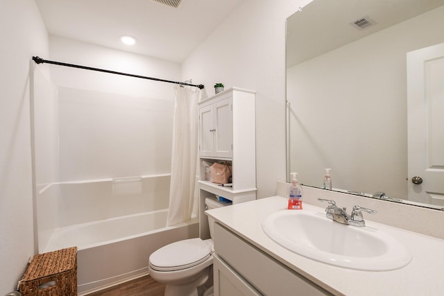 2728 Cadiz Bay Dr, Conroe, TX 77301 - bathroom with toilet, vanity, shower / tub combo with curtain, and wood finished floors