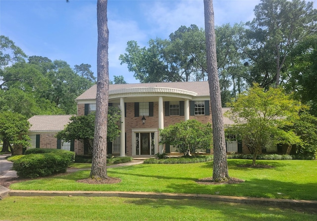 456 Lexington Ct, Conroe, TX 77302 - neoclassical / greek revival house with brick siding and a front yard