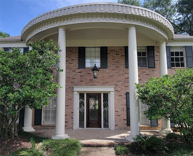 456 Lexington Ct, Conroe, TX 77302 - doorway to property featuring brick siding