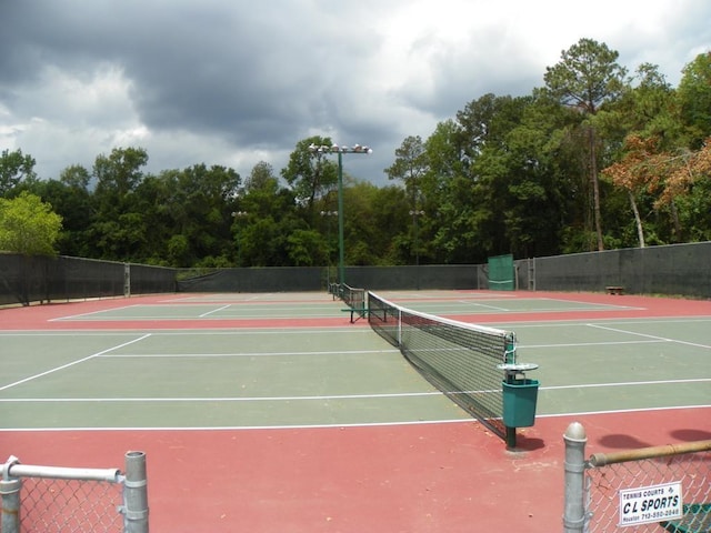 456 Lexington Ct, Conroe, TX 77302 - view of tennis court with community basketball court and fence