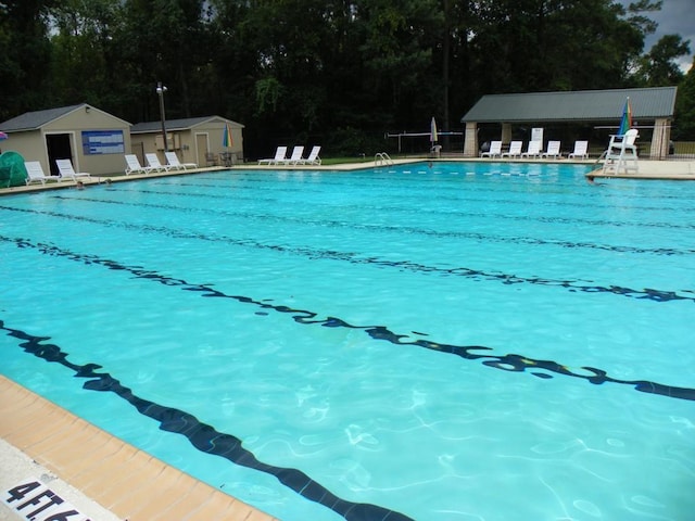 456 Lexington Ct, Conroe, TX 77302 - community pool with view of wooded area