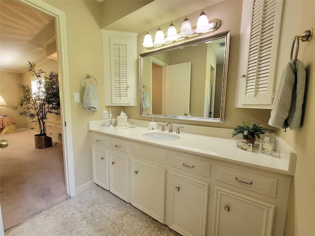456 Lexington Ct, Conroe, TX 77302 - bathroom featuring vanity, crown molding, and baseboards