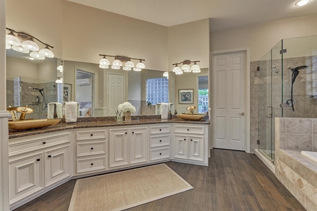 11872 Seashell Cir, Montgomery, TX 77356 - full bathroom with a shower stall, double vanity, and wood finished floors