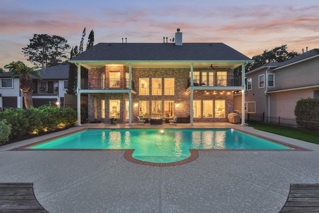 11872 Seashell Cir, Montgomery, TX 77356 - rear view of house featuring a balcony, a patio, fence, an outdoor hangout area, and a chimney