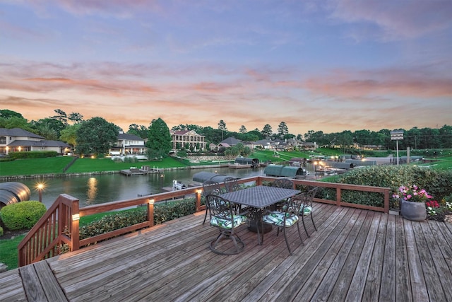 11872 Seashell Cir, Montgomery, TX 77356 - deck at dusk featuring a water view and outdoor dining space