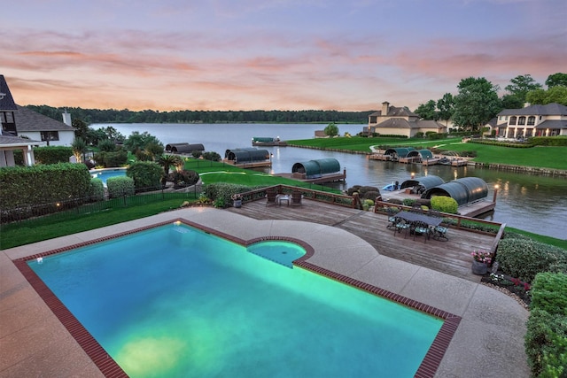 11872 Seashell Cir, Montgomery, TX 77356 - pool at dusk with a deck with water view and an outdoor pool
