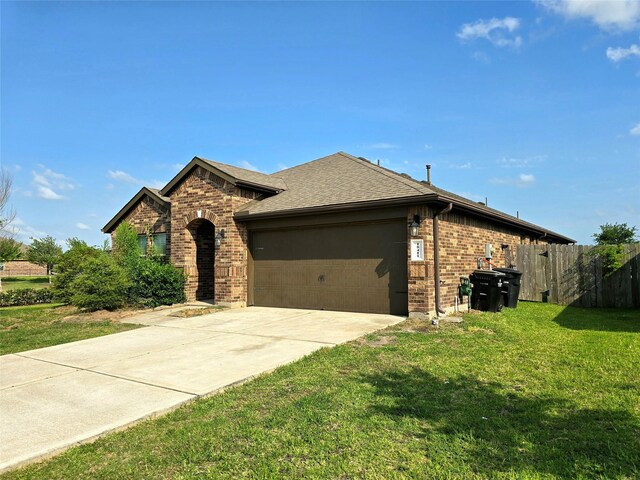 18411 Pelham Hollow Trl, Richmond, TX 77407 - view of front of house featuring brick siding, a garage, concrete driveway, and roof with shingles