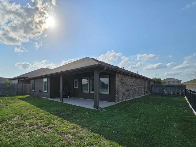 18411 Pelham Hollow Trl, Richmond, TX 77407 - back of property with a patio area and brick siding