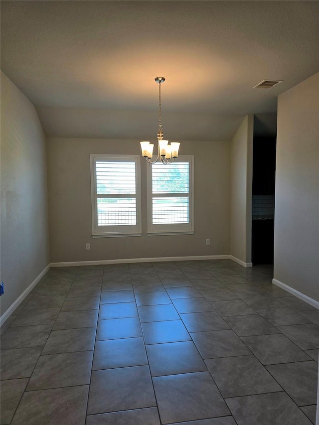 18411 Pelham Hollow Trl, Richmond, TX 77407 - spare room with a chandelier, tile patterned floors, baseboards, and lofted ceiling